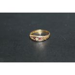 A HALLMARKED 15 CARAT RUBY AND DIAMOND RING, approx weight 2.1g, ring size P