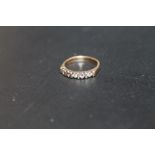 A HALLMARKED 9 CARAT GOLD FIVE STONE DRESS RING, approx weight 2.1g, ring size K