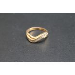 A WAVE CHANNEL SET BAGUETTE DIAMOND RING, stamped Cardow 14k, approx weight 3g, ring size Q