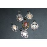 A COLLECTION OF FIVE SILVER FOB MEDALS, together with a enamelled brass example, all awarded to E