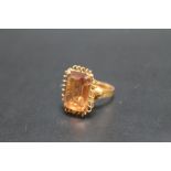 A CONTINENTAL C18 GOLD CITRINE RING, in high gallery setting, ring size P