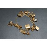 A 9CT GOLD CHARM BRACELET AND CHARMS, approx weight 28.8g