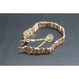 A HALLMARKED 9 CARAT GOLD FOUR TWIST BAR GATE BRACELET, approx weight 11.9g