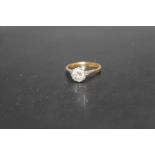 A 18CT GOLD AND PLATINUM DIAMOND SOLITAIRE RING, having an illusion set brilliant cut diamond of