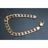 A HALLMARKED 9 CARAT GOLD CURB LINK BRACELET, clasp is a later replacement, approx weight 28.4g, L
