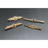 TWO 9CT PIN BROOCHES, together with two other pin badges (4)