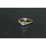 AN 18CT AND PLATINUM DIAMOND SOLITAIRE RING, set with a brilliant cut diamond of and estimated