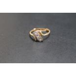 A 9CT GOLD THREE STONE DIAMOND RING, fitted with a size adjustment, approx weight 2.3g, current ring