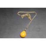 A RUSSIAN 875 GOLD HALLMARKED AMBER 'TEAR DROP' PENDANT, on similar marked chain, pendant H 2.5 cm