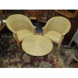 A PAIR OF WICKER ARMCHAIRS AND A STOOL