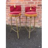 A PAIR OF VINTAGE UPHOLSTERED STOOLS
