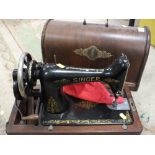 A MAHOGANY VINTAGE CASED SINGER SEWING MACHINE