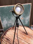 A HEAVY BRASS CARBIDE TABLE LAMP MOUNTED ON A LATER BLACK PAINTED TRIPOD STAND