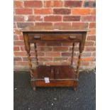 A SMALL OAK BARLEYTWIST TABLE WITH UNUSUAL CUPBOARD BELOW