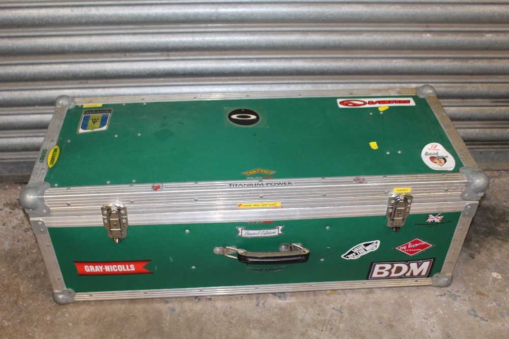 A LARGE HARD CASE CONTAINING CRICKET RELATED ITEMS TO INCLUDE A CRICKET BAT, PADS, HELMET ETC.