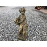 A WEATHERED RECONSTITUTED STONE FIGURE 'SUMMER', modelled as a boy carrying a basket of flowers.