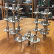 SEVEN MID-20th CENTURY STACKABLE CANDLE HOLDERS BY FRITZ NAGEL FOR BMF each cast metal three-light