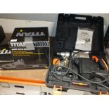A TITAN 2000W ELECTRIC CHAINSAW TOGETHER WITH A CASED CHALLENGE ROTARY HAMMER DRILL
