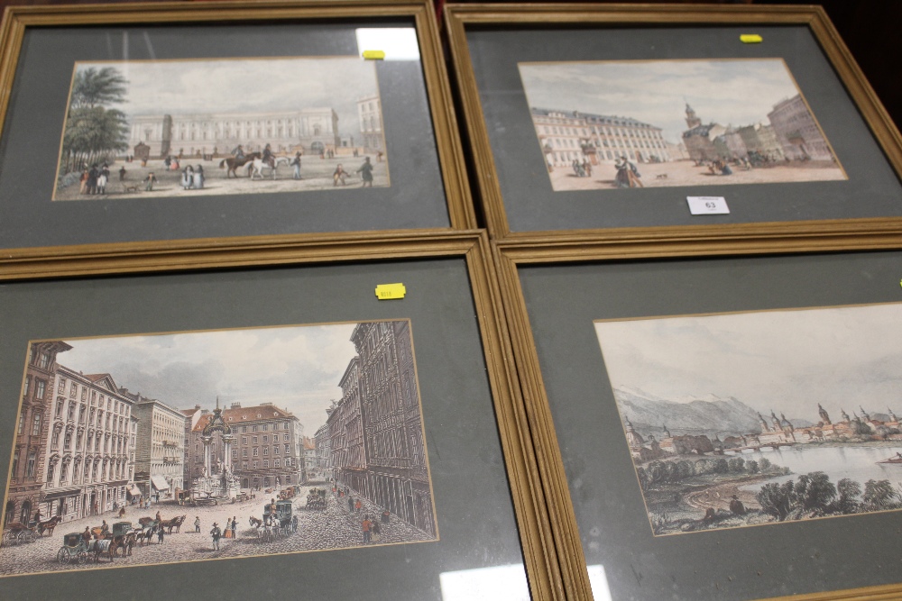 A SET OF FOUR COLOURED PRINTS OF TOWN SCENES