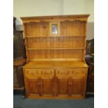 A MODERN PINE KITCHEN DRESSER WITH LEADED STAINED GLASS DETAIL H-203 W-155 CM