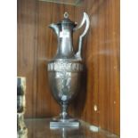 A SILVER PLATED CLARET JUG