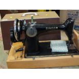 A CASED VINTAGE SINGER SEWING MACHINE