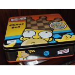 A WOODEN SIMPSONS CHESS SET