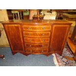 A REPRODUCTION MAHOGANY INLAID SHAPED SIDEBOARD W-137 CM