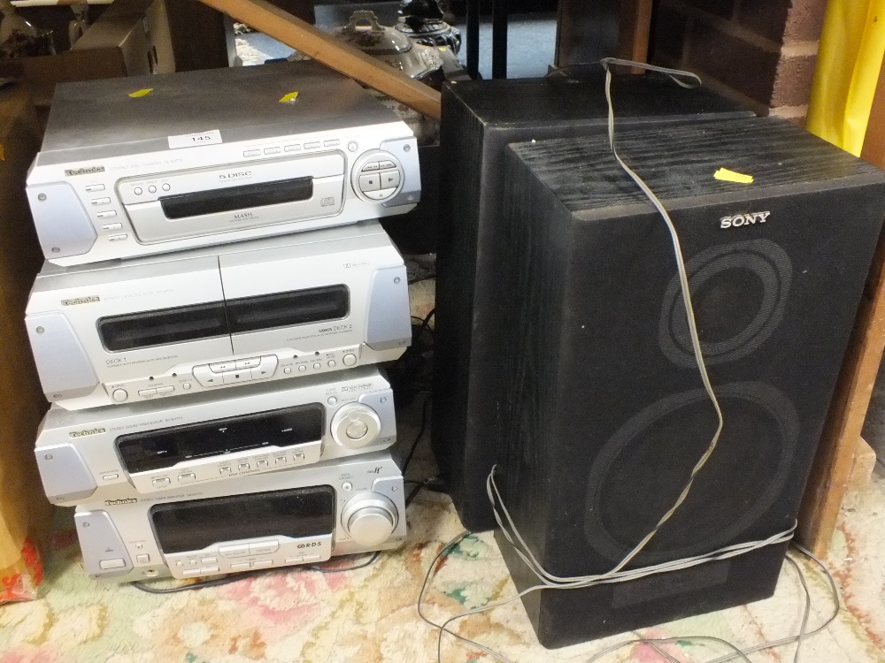 A TECHNICS STACKING STEREO SYSTEM AND TWO SONY SPEAKERS