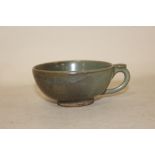 AN ORIENTAL CELADON STYLE CUP - DIAMETER 9CM