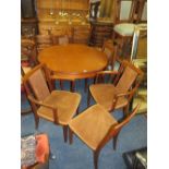 A RETRO TEAK G-PLAN EXTENDING DINING TABLE WITH SIX CHAIRS