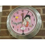 A MODERN ILLUMINATING BETTY BOO CIRCULAR WALL CLOCK