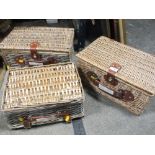 THREE WICKER PICNIC BASKETS AND CONTENTS