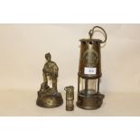 AN ECCLES TYPE 6 MINERS LAMP TOGETHER WITH A SMALLER EXAMPLE AND A BRASS MINOR FIGURE