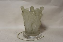 A RESIN TABLE LAMP DECORATED WITH FOUR FEMALE FIGURES