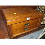 A VINTAGE OAK CASED THREE TIER CANTEEN OF CUTLERY