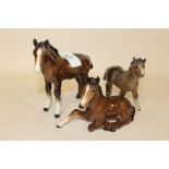 TWO BESWICK FOAL FIGURES TOGETHER WITH A BESWICK SHETLAND FOAL FIGURE