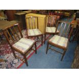 A SET OF FOUR OAK VINTAGE DINING CHAIRS