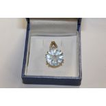 A 9 CARAT GOLD, BLUE TOPAZ AND DIAMOND SET PENDANT