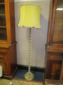 A VINTAGE GLASS AND BRASS EFFECT STANDARD LAMP