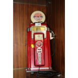 A NOVELTY TELEPHONE IN THE FORM OF A PETROL PUMP