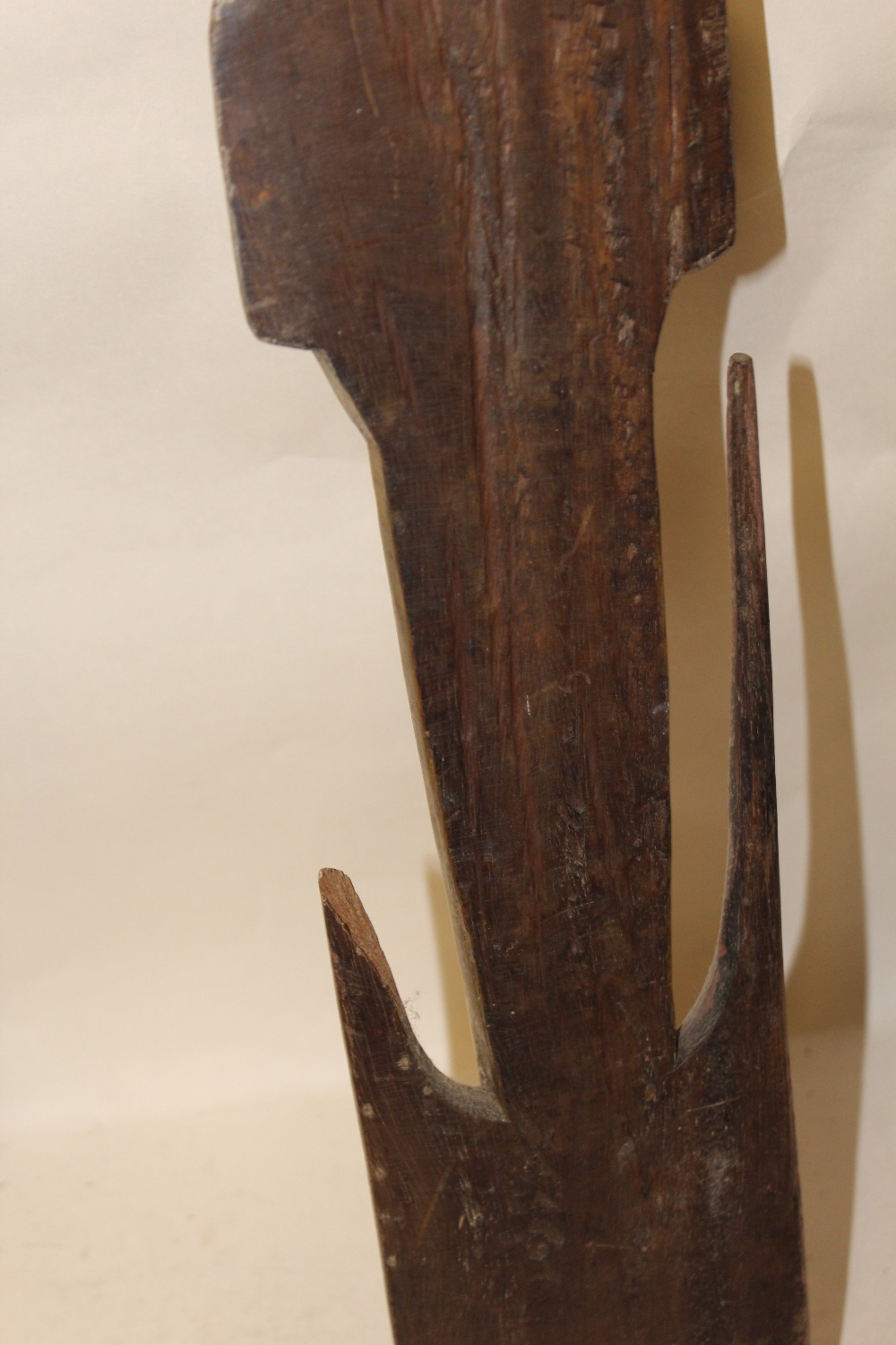 A PAPUA NEW GUINEA MASK AND A CARVED WOODEN AXE HANDLE - Image 3 of 3
