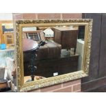 A MODERN GILT RECTANGULAR MIRROR 55 X 70 CM