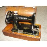 A CASED VINTAGE SINGER SEWING MACHINE