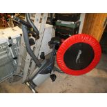 A ROGER BLACK FITNESS EXERCISE BIKE TOGETHER WITH AN EXERCISE TRAMPOLINE