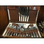 AN OAK CASED CANTEEN OF CUTLERY