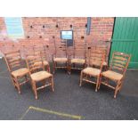 A SET OF EIGHT OAK WICKERSEAT LANCASHIRE STYLE CHAIRS ( 2 CARVERS )