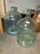 TWO GLASS CARBOY BOTTLES