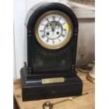 A SLATE AND MALACHITE DOMED TOP MANTEL CLOCK