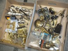 TWO TRAYS OF BRASSWARE, CONSISTING OF DOOR HANDLES, DRAWER HANDLES ETC.